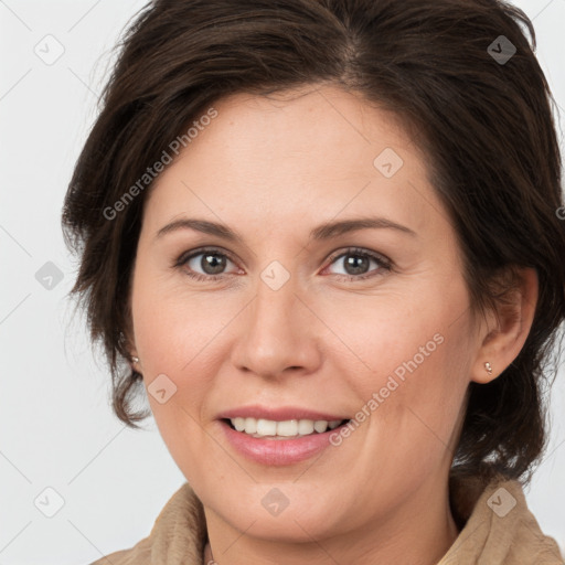 Joyful white adult female with medium  brown hair and brown eyes