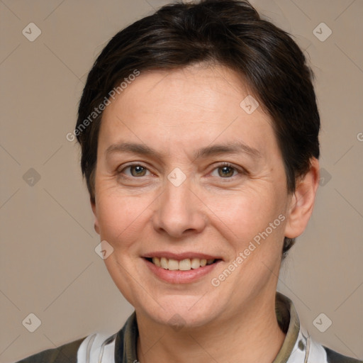 Joyful white adult female with medium  brown hair and brown eyes