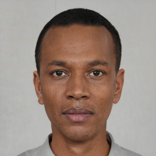Neutral black young-adult male with short  black hair and brown eyes