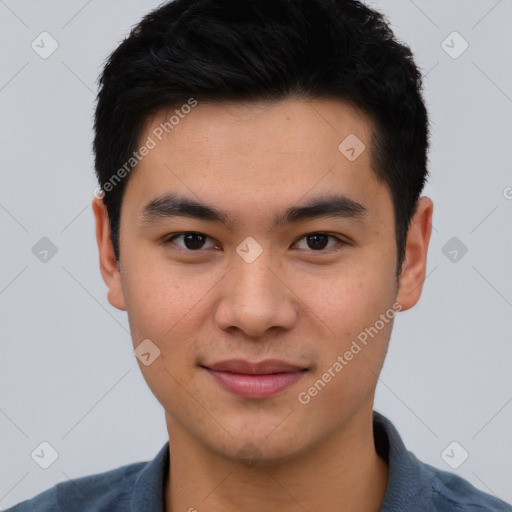 Joyful asian young-adult male with short  black hair and brown eyes