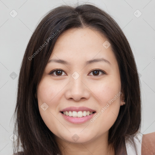 Joyful white young-adult female with long  brown hair and brown eyes