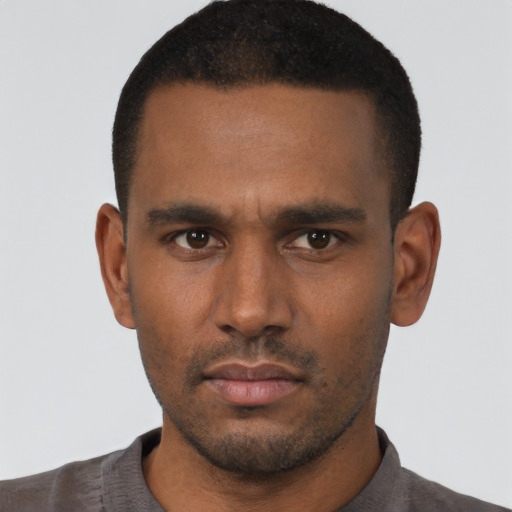 Neutral black young-adult male with short  black hair and brown eyes