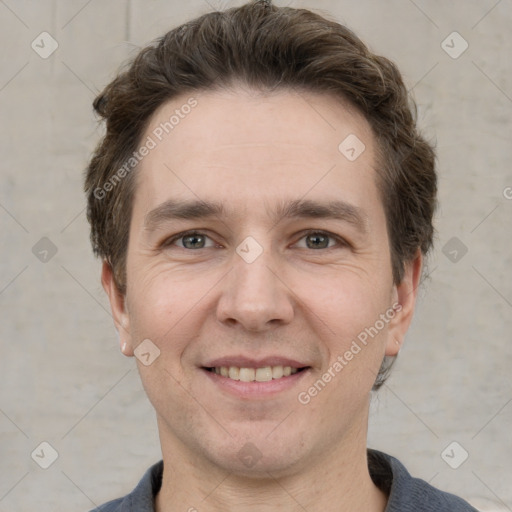 Joyful white adult male with short  brown hair and grey eyes