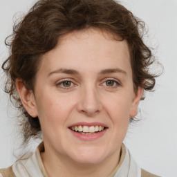 Joyful white young-adult female with medium  brown hair and green eyes