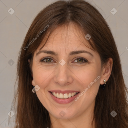 Joyful white adult female with long  brown hair and brown eyes