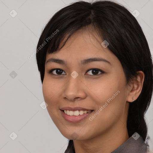 Joyful asian young-adult female with medium  black hair and brown eyes