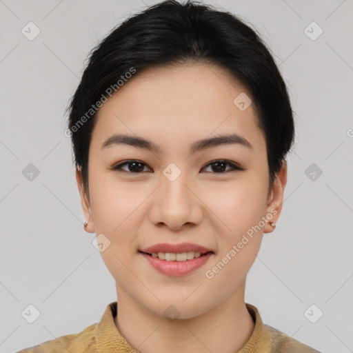 Joyful asian young-adult female with short  black hair and brown eyes