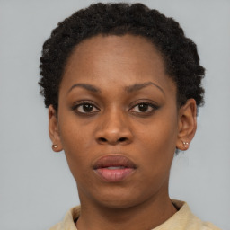 Neutral black young-adult female with short  brown hair and brown eyes