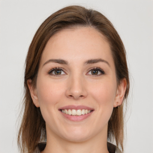 Joyful white young-adult female with medium  brown hair and brown eyes