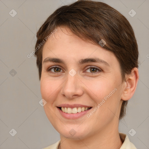 Joyful white young-adult female with medium  brown hair and brown eyes