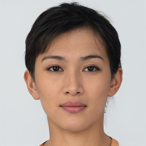 Joyful asian young-adult female with short  brown hair and brown eyes