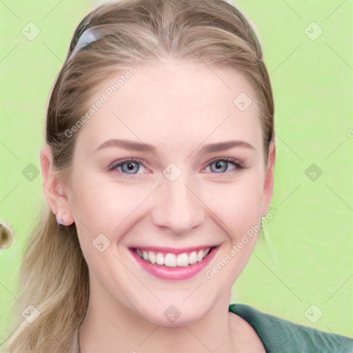 Joyful white young-adult female with long  brown hair and blue eyes