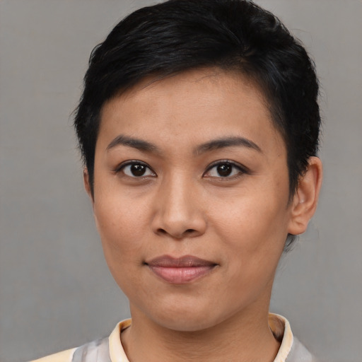 Joyful asian young-adult female with short  brown hair and brown eyes