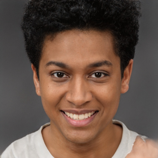 Joyful latino young-adult male with short  brown hair and brown eyes