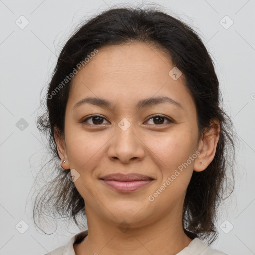 Joyful latino young-adult female with medium  brown hair and brown eyes