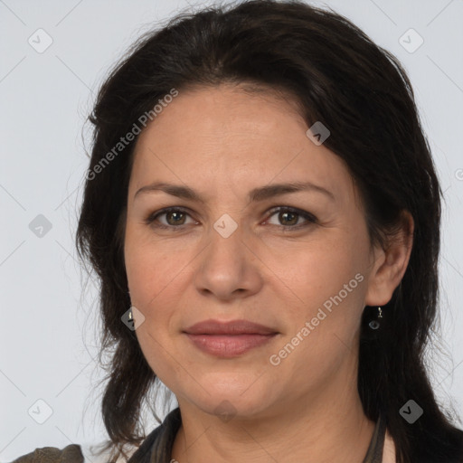 Joyful white adult female with medium  brown hair and brown eyes