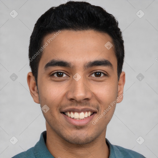 Joyful latino young-adult male with short  black hair and brown eyes