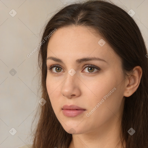 Neutral white young-adult female with long  brown hair and brown eyes