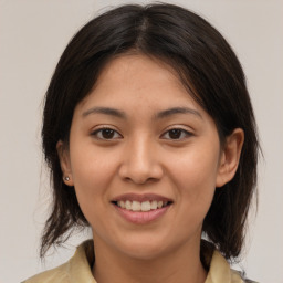 Joyful white young-adult female with medium  brown hair and brown eyes