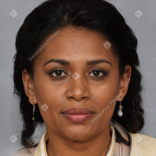 Joyful latino adult female with medium  brown hair and brown eyes