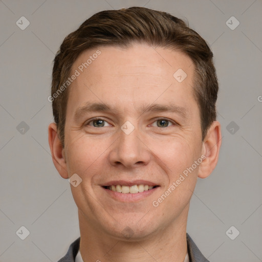 Joyful white adult male with short  brown hair and grey eyes