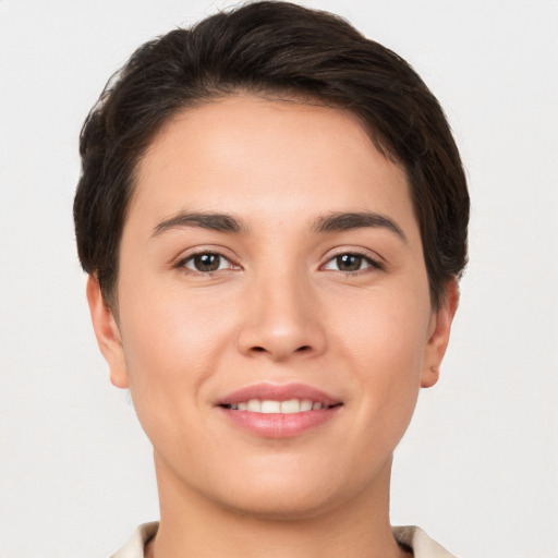 Joyful white young-adult female with short  brown hair and brown eyes