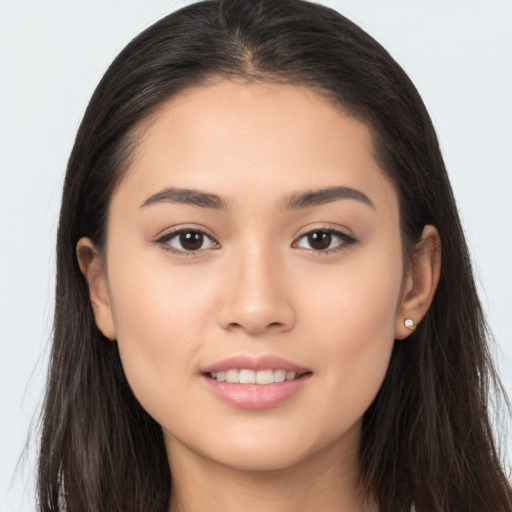 Joyful white young-adult female with long  brown hair and brown eyes