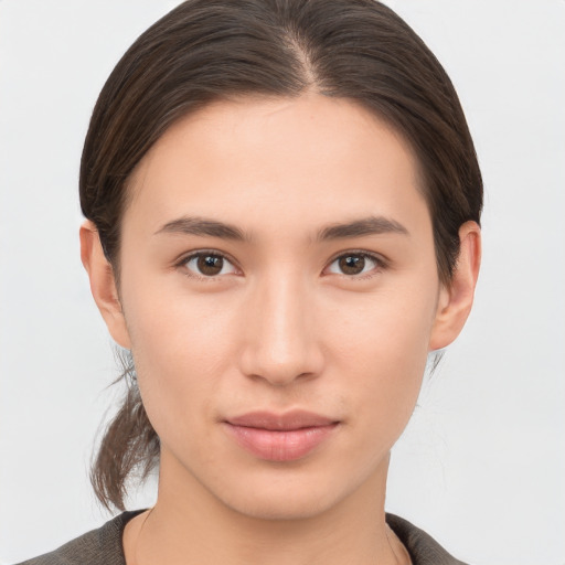 Neutral white young-adult female with short  brown hair and brown eyes