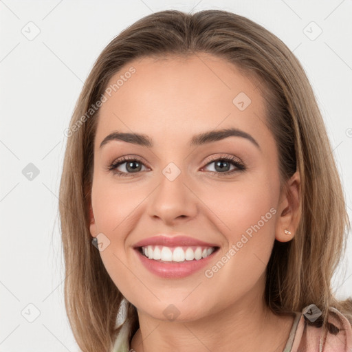 Joyful white young-adult female with long  brown hair and grey eyes