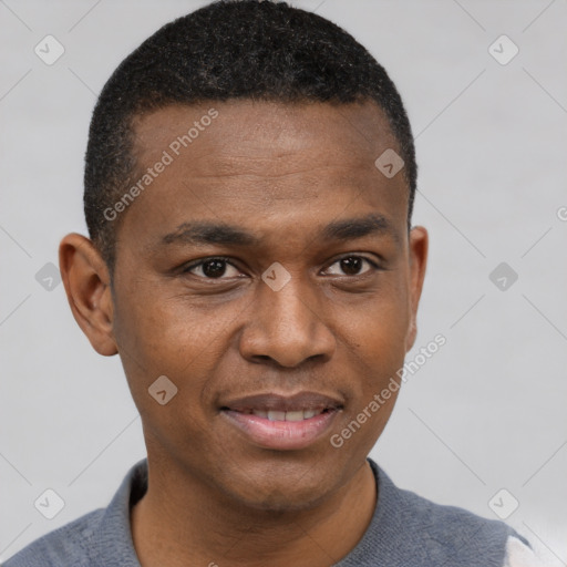 Joyful black young-adult male with short  brown hair and brown eyes