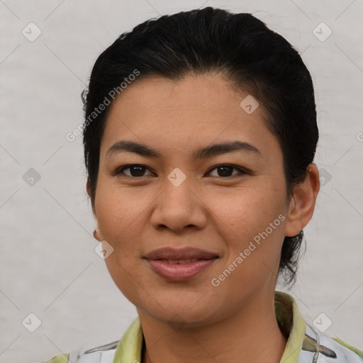 Joyful latino young-adult female with short  brown hair and brown eyes