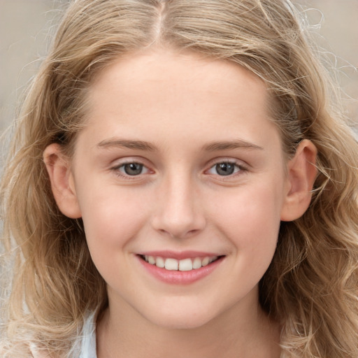 Joyful white child female with long  brown hair and grey eyes