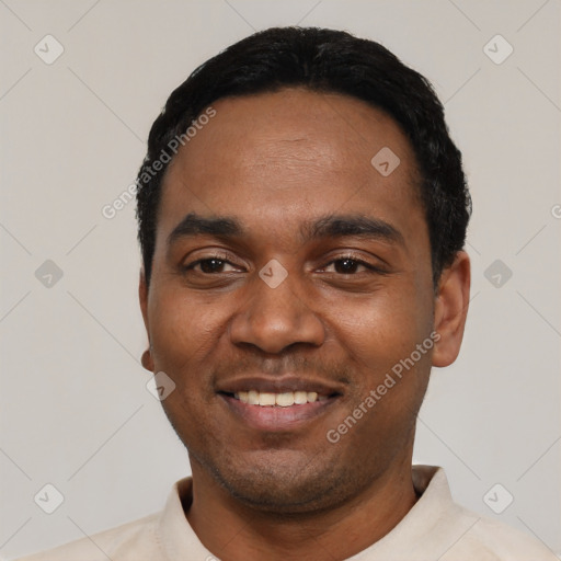 Joyful black young-adult male with short  black hair and brown eyes
