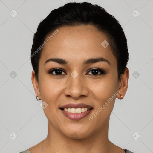 Joyful latino young-adult female with short  black hair and brown eyes