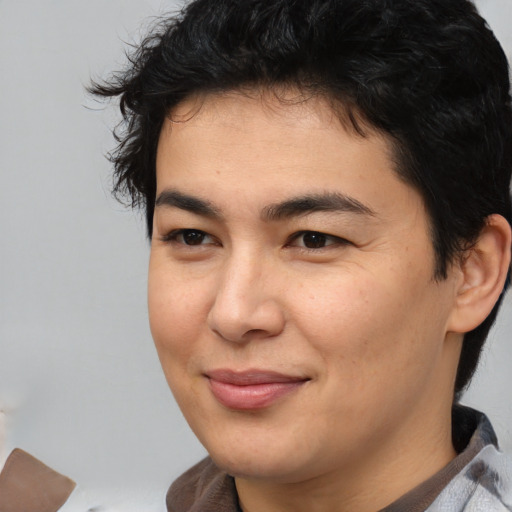 Joyful asian young-adult male with medium  brown hair and brown eyes