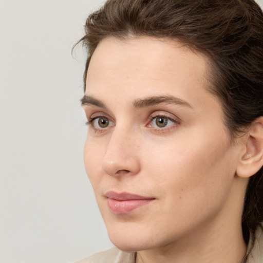 Neutral white young-adult female with medium  brown hair and brown eyes