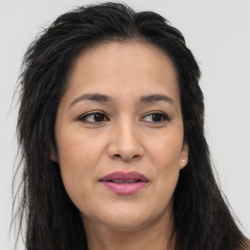 Joyful asian young-adult female with long  brown hair and brown eyes