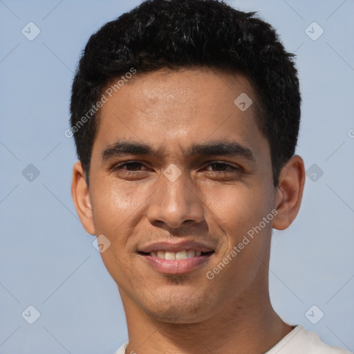 Joyful white young-adult male with short  black hair and brown eyes