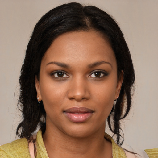 Neutral black young-adult female with medium  brown hair and brown eyes