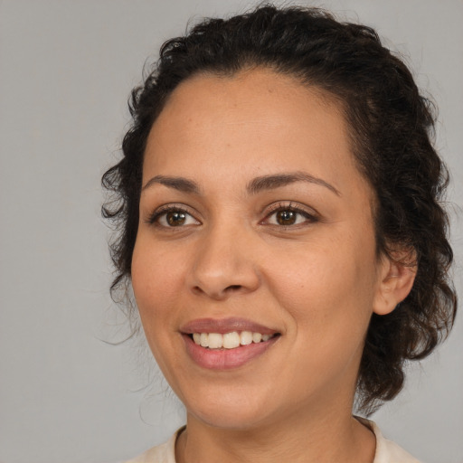 Joyful white young-adult female with medium  brown hair and brown eyes