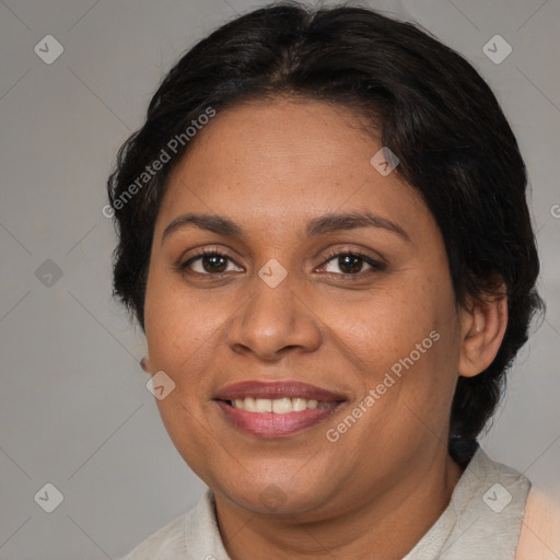 Joyful latino adult female with medium  brown hair and brown eyes