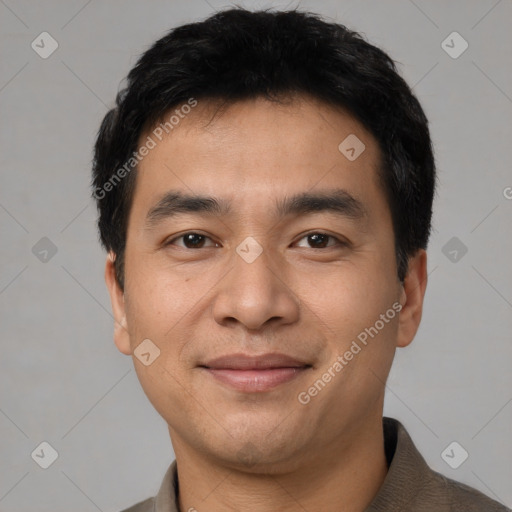 Joyful white young-adult male with short  black hair and brown eyes