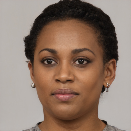 Neutral black young-adult female with short  black hair and brown eyes