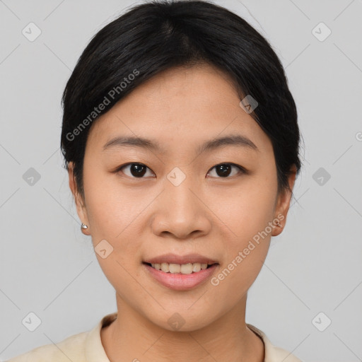 Joyful asian young-adult female with short  black hair and brown eyes