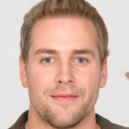 Joyful white adult male with short  brown hair and grey eyes