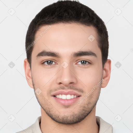 Joyful white young-adult male with short  brown hair and brown eyes