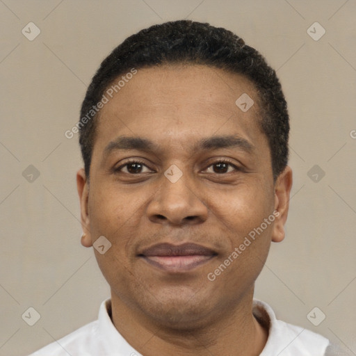 Joyful latino adult male with short  black hair and brown eyes