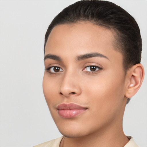 Joyful latino young-adult female with short  brown hair and brown eyes