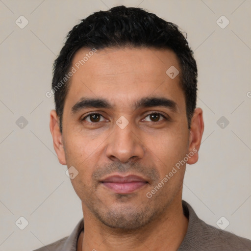 Neutral latino young-adult male with short  black hair and brown eyes