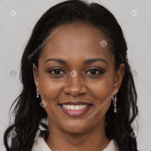 Joyful black young-adult female with long  brown hair and brown eyes